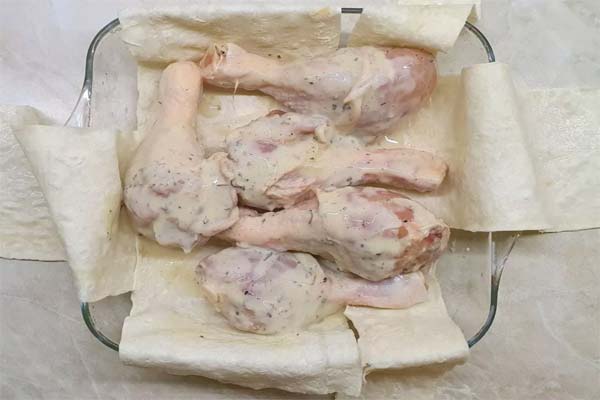 Chicken legs in pita bread
